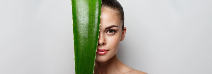 Chiropractic Calgary AB Woman With Aloe Leaf In Front Of Face